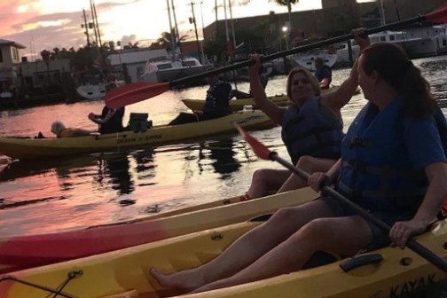 a man and a woman sitting on a boat