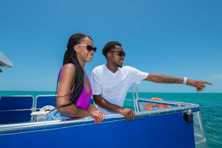 a woman sitting on a boat in the water