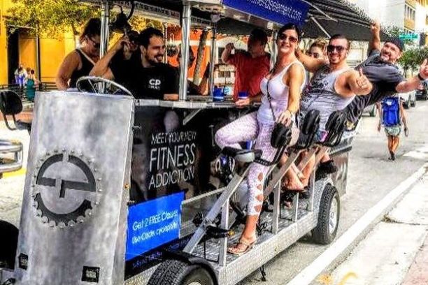 a group of people riding on the back of a truck