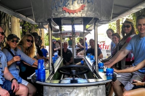 a group of people standing on a boat