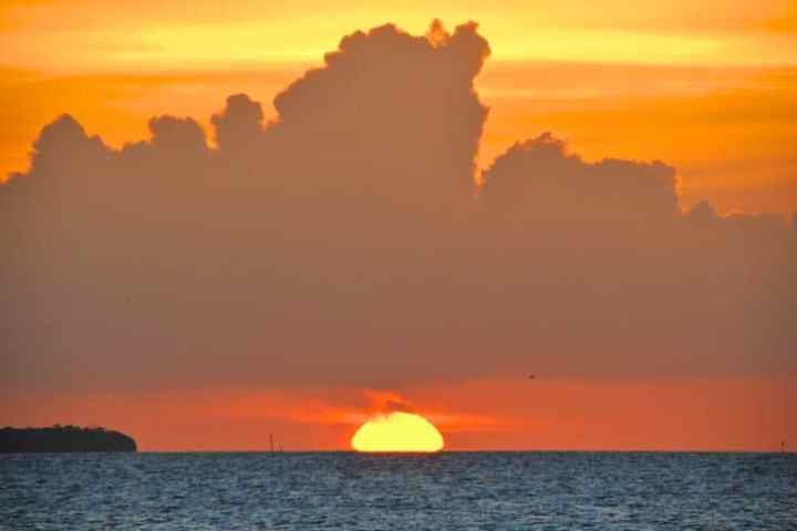 a sunset over a body of water