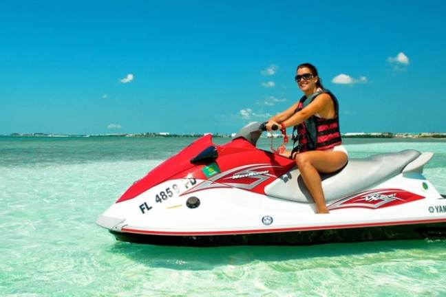 a person sitting next to a body of water