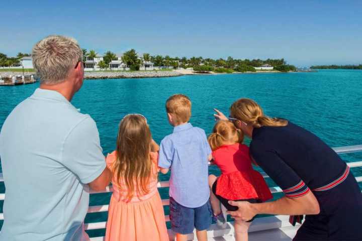 a group of people standing in front of a body of water