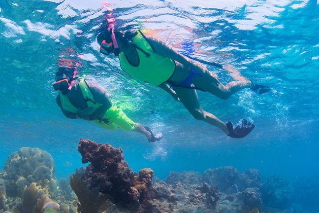 a man riding a wave on a surfboard in the water