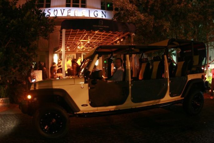 a truck that is driving down the street