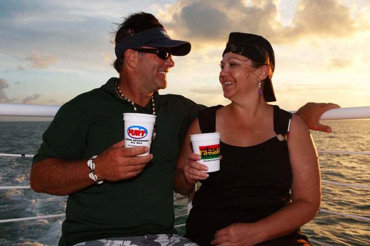 a person standing next to a body of water