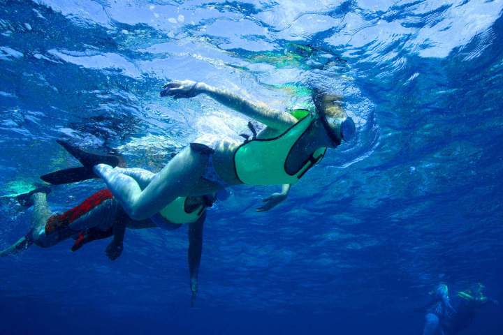 a man riding a wave on a surfboard in the water