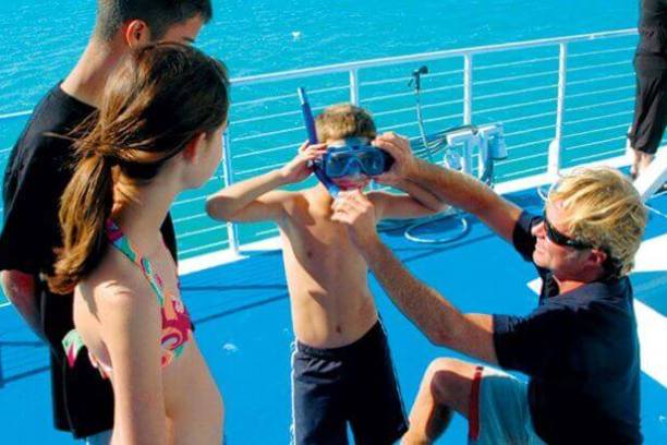 a man and woman swimming in the water