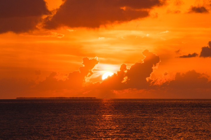 a sunset over a body of water
