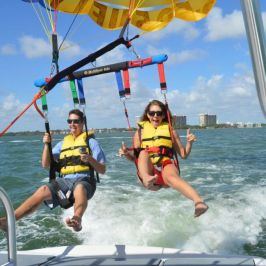 a group of people riding on the back of a boat