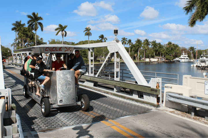 a group of people riding on the back of a truck